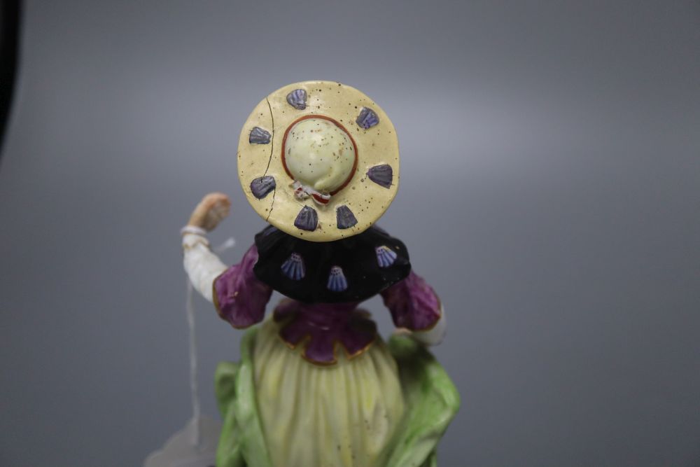 A Meissen style figure of a lady, height 19cm, and a biscuit bust of Shakespeare,